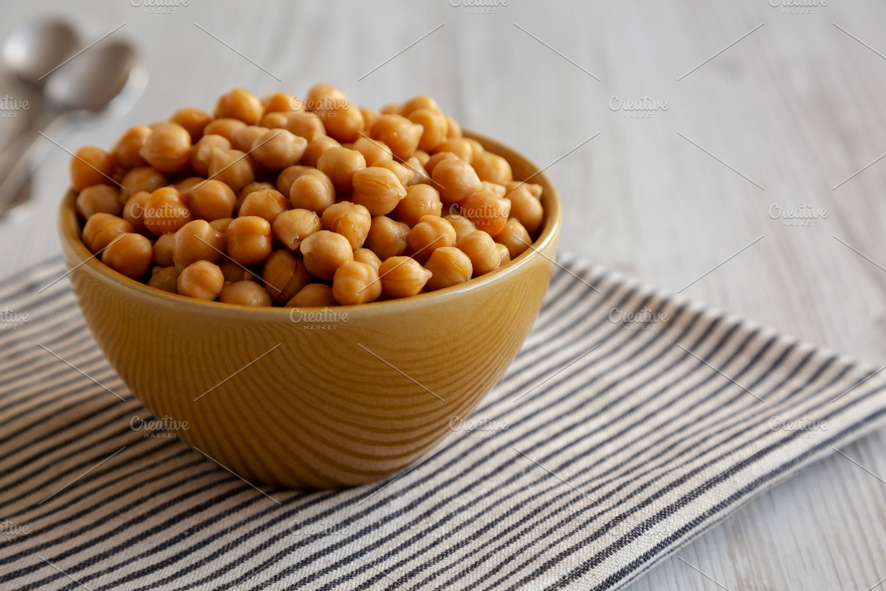 Organic Raw Canned Chickpeas in a Bowl, low angle view. Copy spa, a Food & Drink Photo by LiudmylaChuhunova
