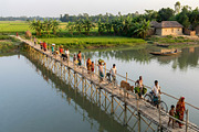 Villagers crossing a bamboo bridge, a Person Photo by nandinigraphics (Thumbnail 2 of 3)