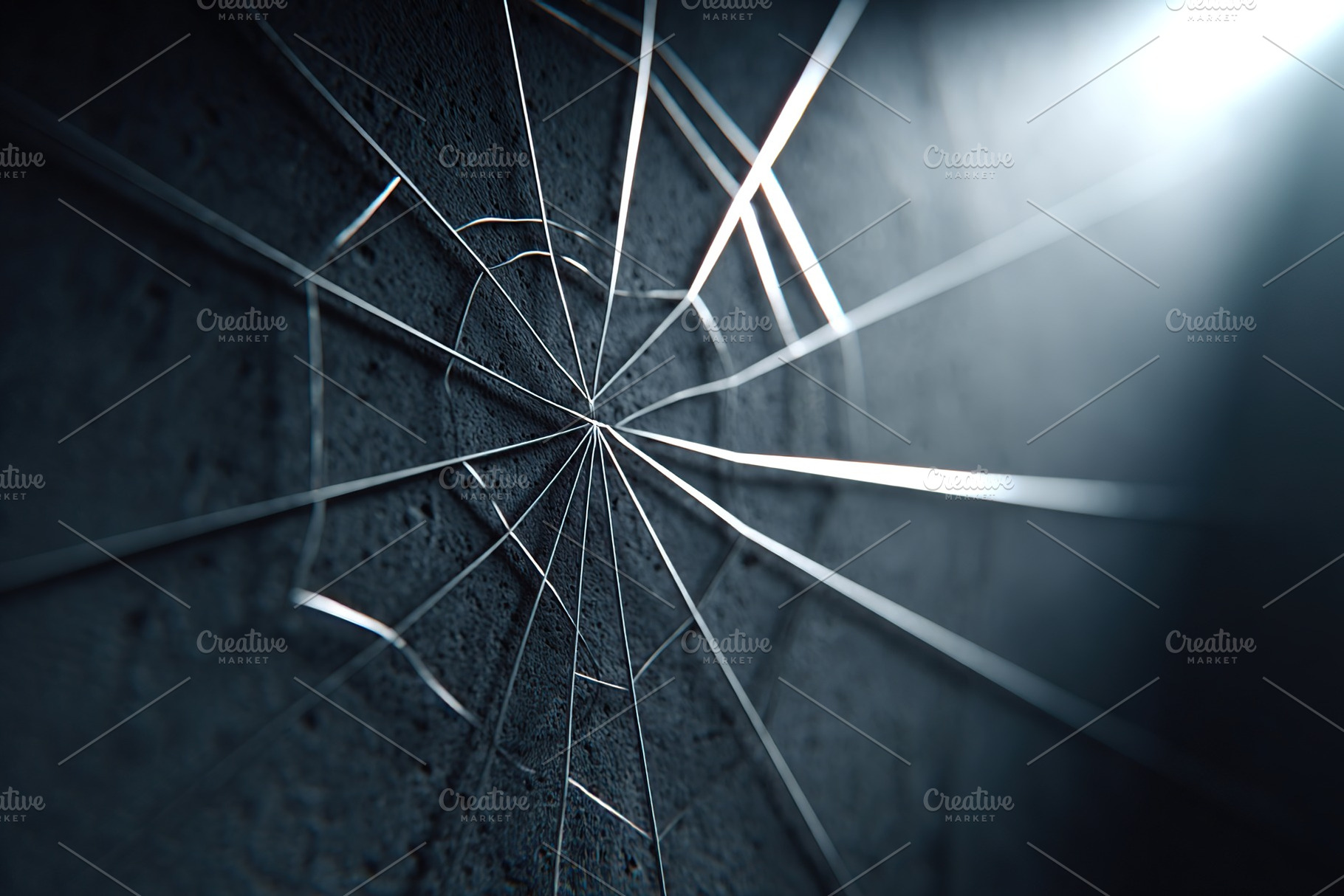 Delicate spider web glistening in soft light against a textured grey wall, a Photo by AlyaAnd