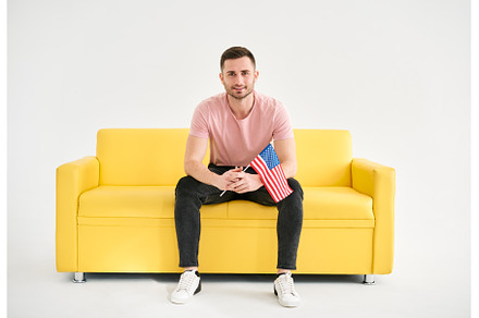 Young cheerful man with american, a Person Photo by Gladkov photography