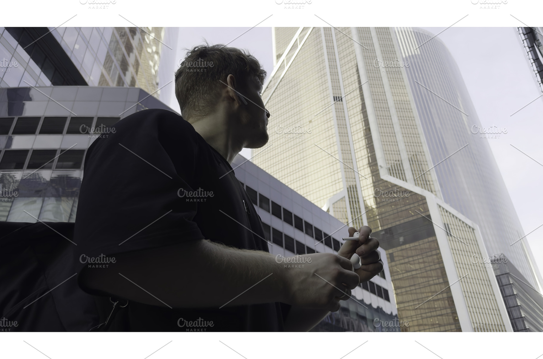 Young manager walking and talking on, an Architecture Photo by Media Whale Stock