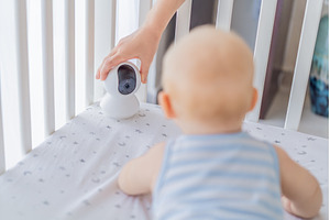 Baby monitor camera placed inside a, a Technology Photo by Elizaveta Galitskaya