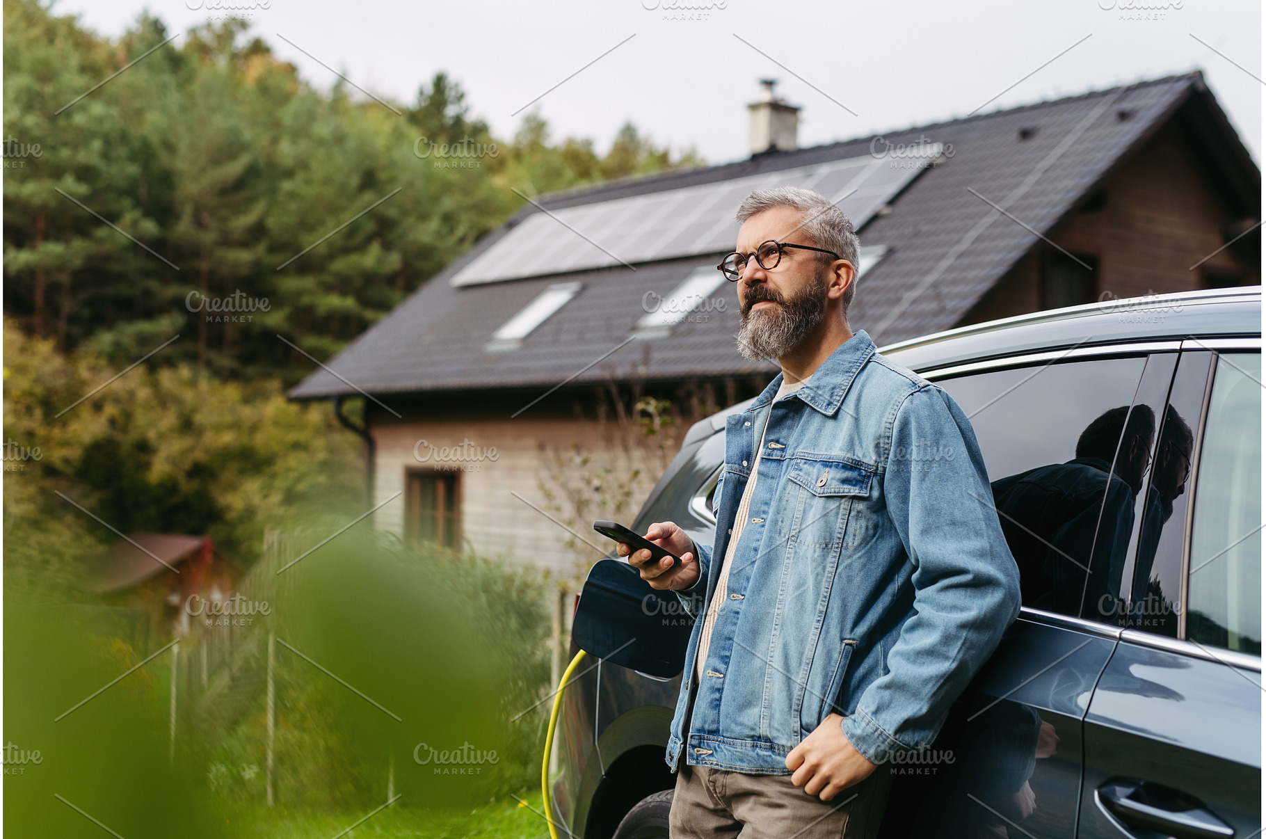 Charging electric car at home, using, a Transportation Photo by HalfPoint