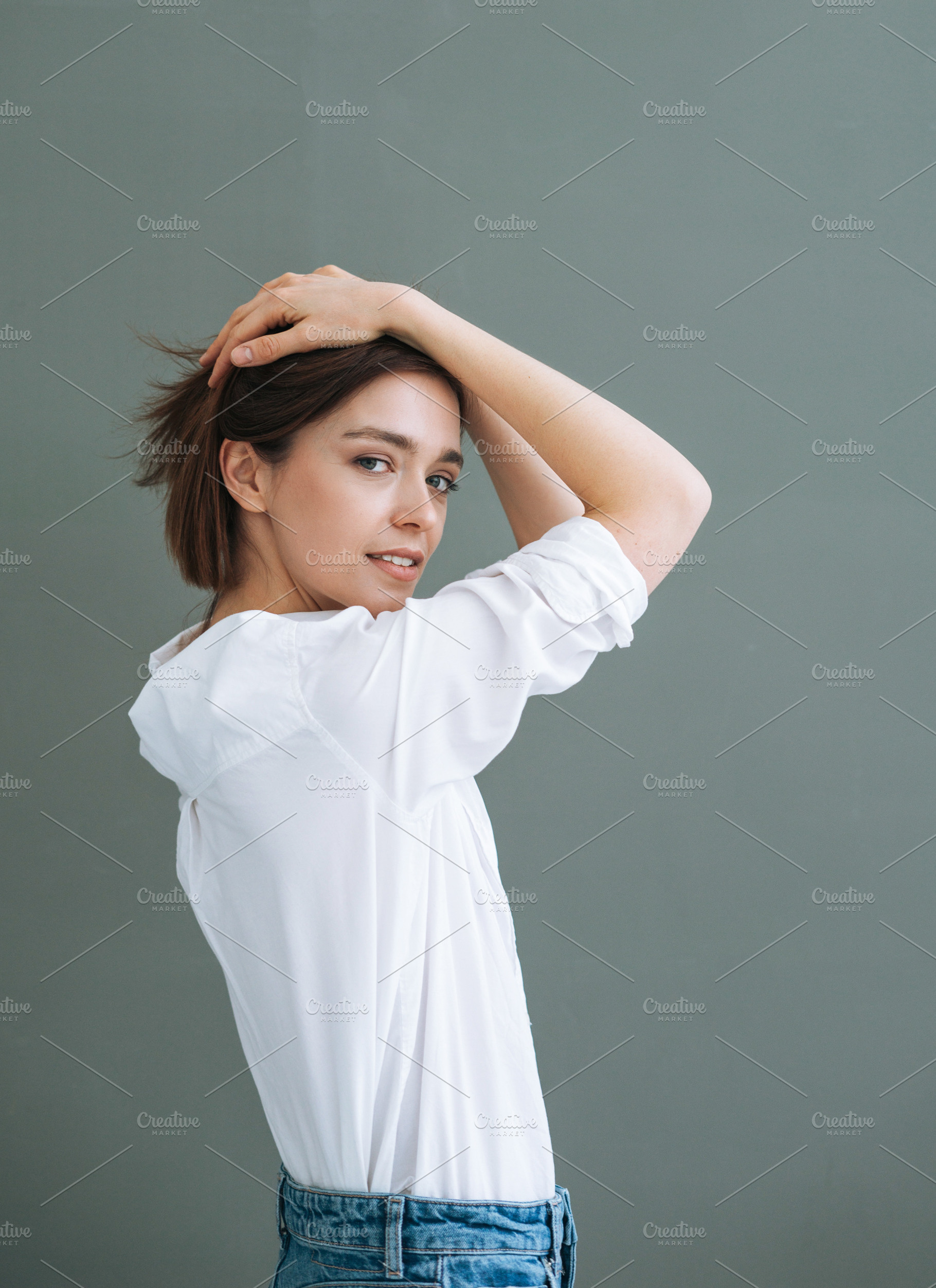 Young woman on grey background, a Person Photo by Galina_Zhigalova