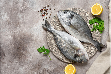 Fresh raw dorado fish with spices, a Food & Drink Photo by Yulia71