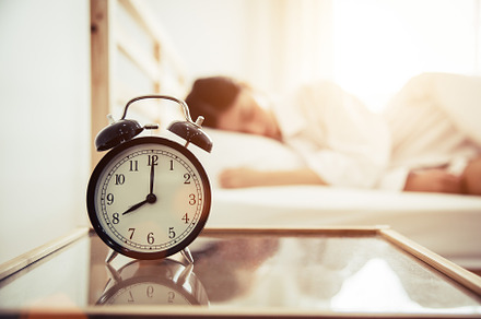 Alarm clock with beauty woman in background. Morning and Lazy ti, a Person Photo by Ministocker
