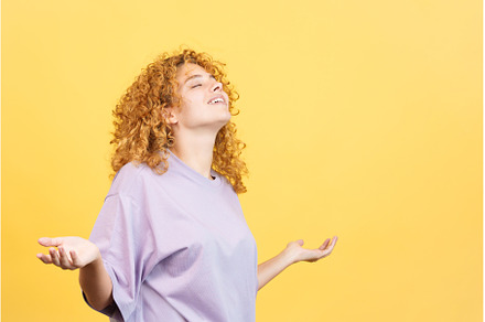 Woman standing with closed eyes and, a Person Photo by Iván Moreno STOCK PHOTO