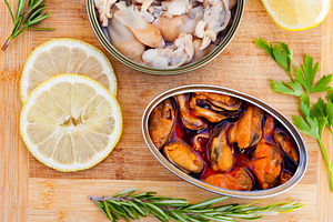 Cans of preserve with lemon and differents herbs, a Food & Drink Photo by José Manuel Gelpi