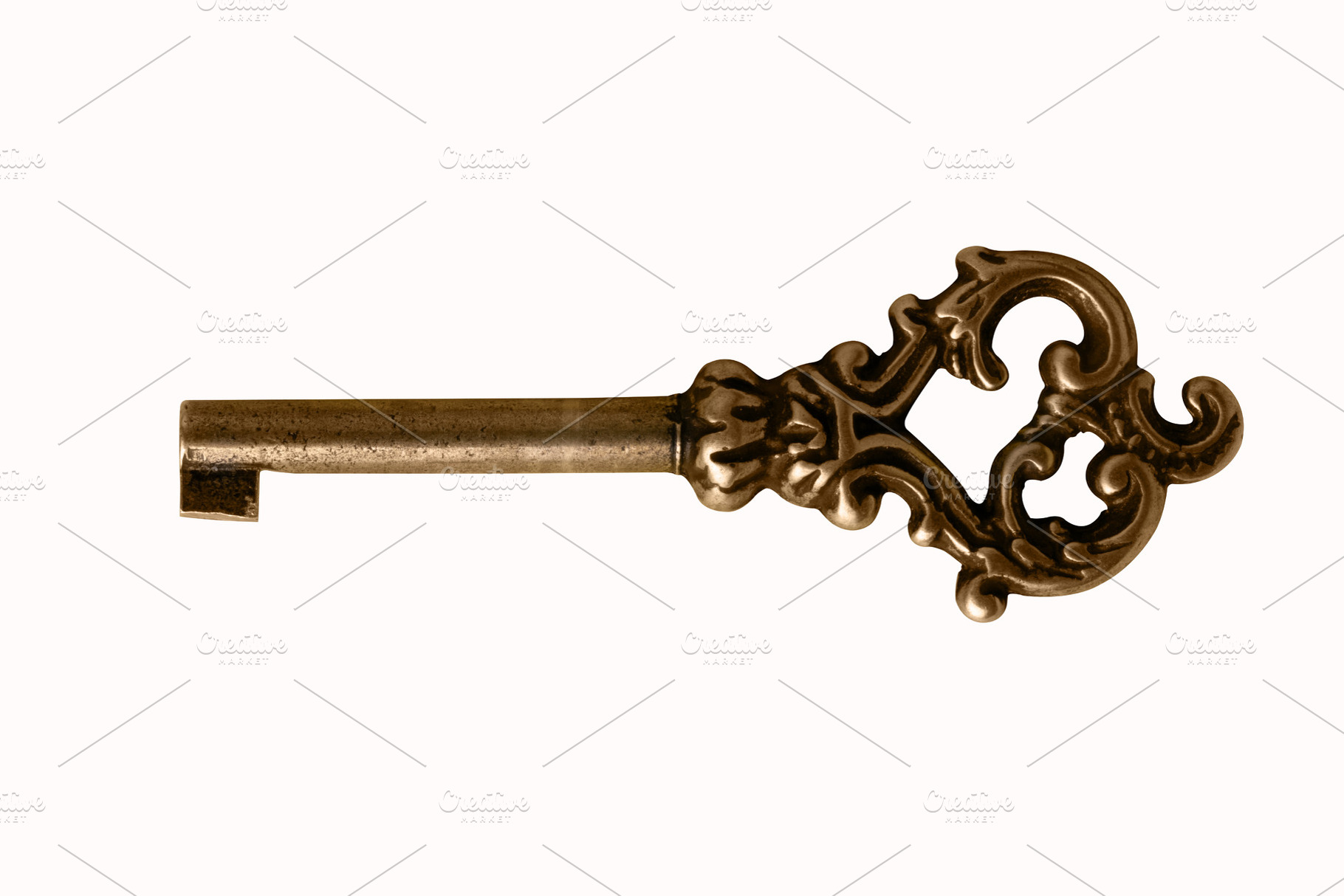 Vintage decorative brass skeleton key isolated on white backgrou, an Abstract Photo by Ales Munt