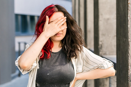 Stylish woman making face palm gestu, a Person Photo by Andriana Syvanych