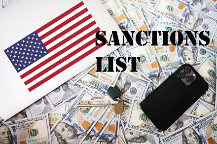 Sanctions list concept. USA flag, dollar money with keys, laptop, a Business Photo by AS photostudio