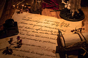 Ancient parchment with handwritten text and ink bottle nearby, a Background Photo by GoodGoods (Thumbnail 1 of 2)
