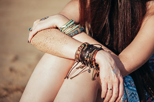 Close up hands with boho accessories featuring jewelry, bohemian, and boho
