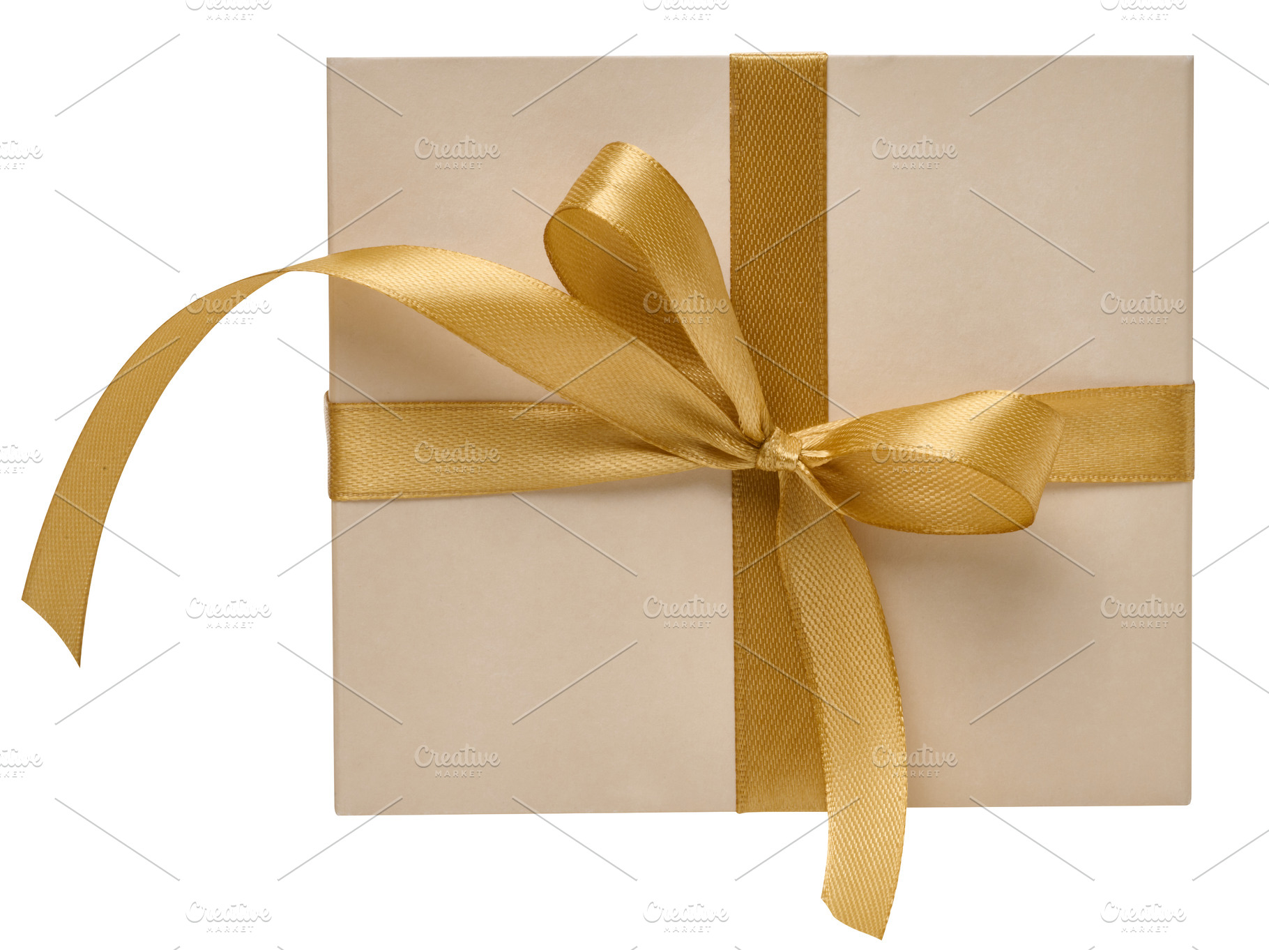 Beige gift box with golden satin ribbon on isolated background, a Holiday Photo by ndanko