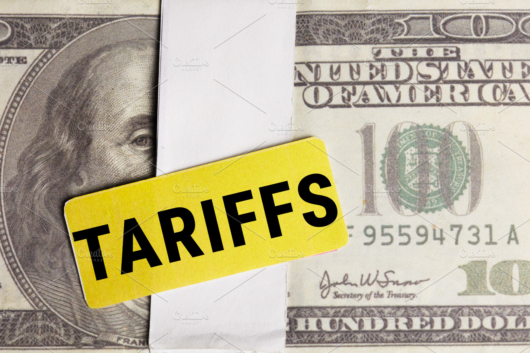 Tariff Costs Visualized on Hundred Dollar Bill, a Business Photo by Alliance Images