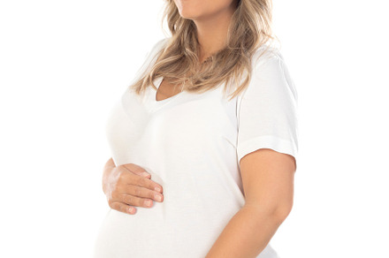Young beautiful blonde woman pregnant expecting baby over isolat, a Person Photo by José Manuel Gelpi