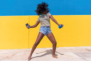 Mixed race smiling black woman portr containing funky, curly, and people
