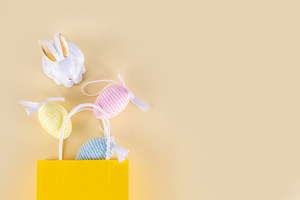 Minimal Easter shopping background with bunny rabbit decor and E, a Holiday Photo by Rimma