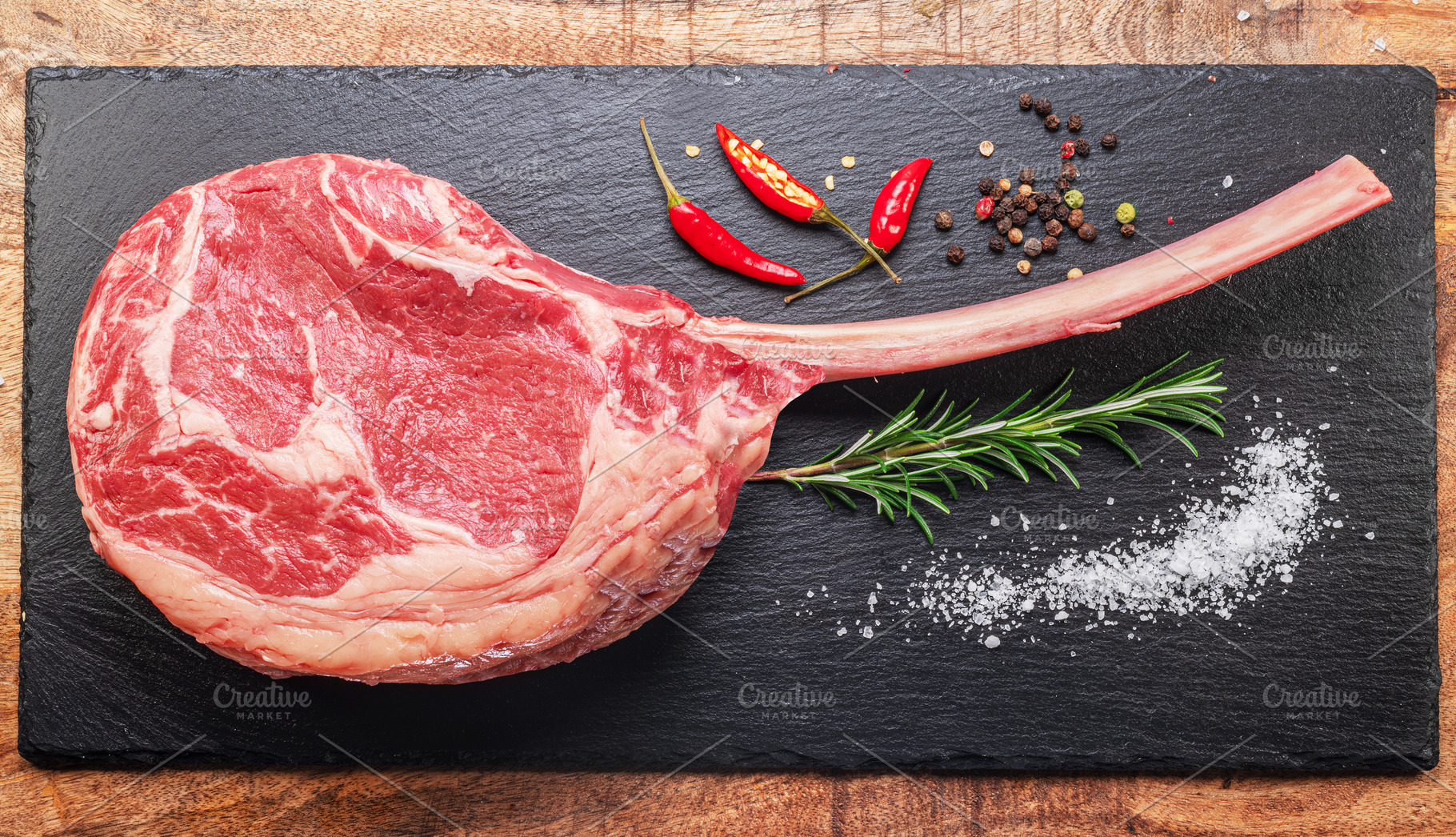 Raw rib steak with bone, a Food & Drink Photo by Volff