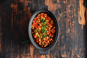 Traditional Mexican Beef Chili Con Carne in Black Dish on Rustic, a Food & Drink Photo by Natalia Klenova's Shop