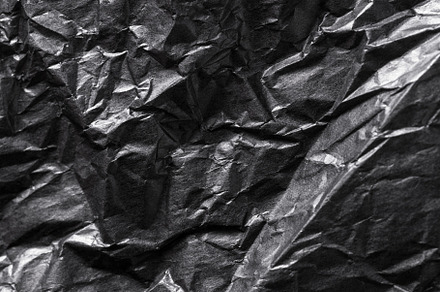 Black Crumpled Paper textured background, an Abstract Photo by MDBildes