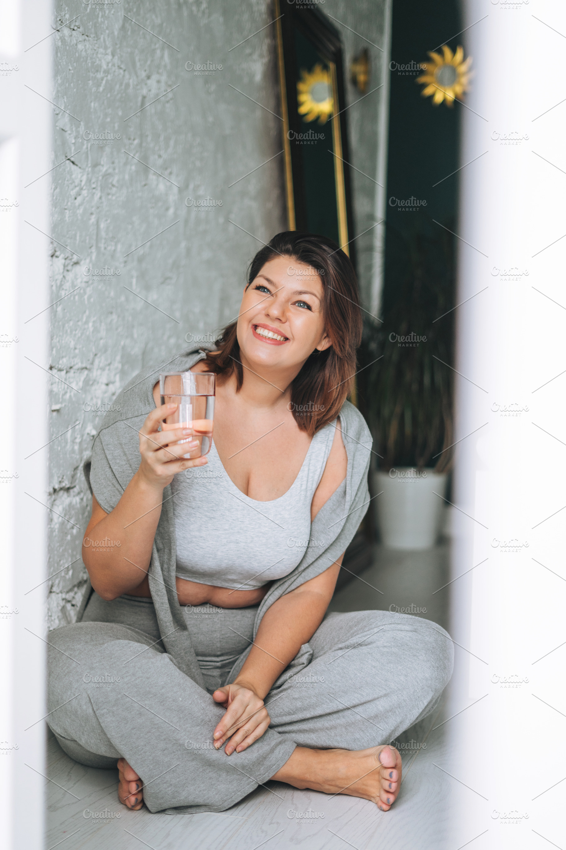 Young woman plus size in sport wear, a Person Photo by Galina_Zhigalova