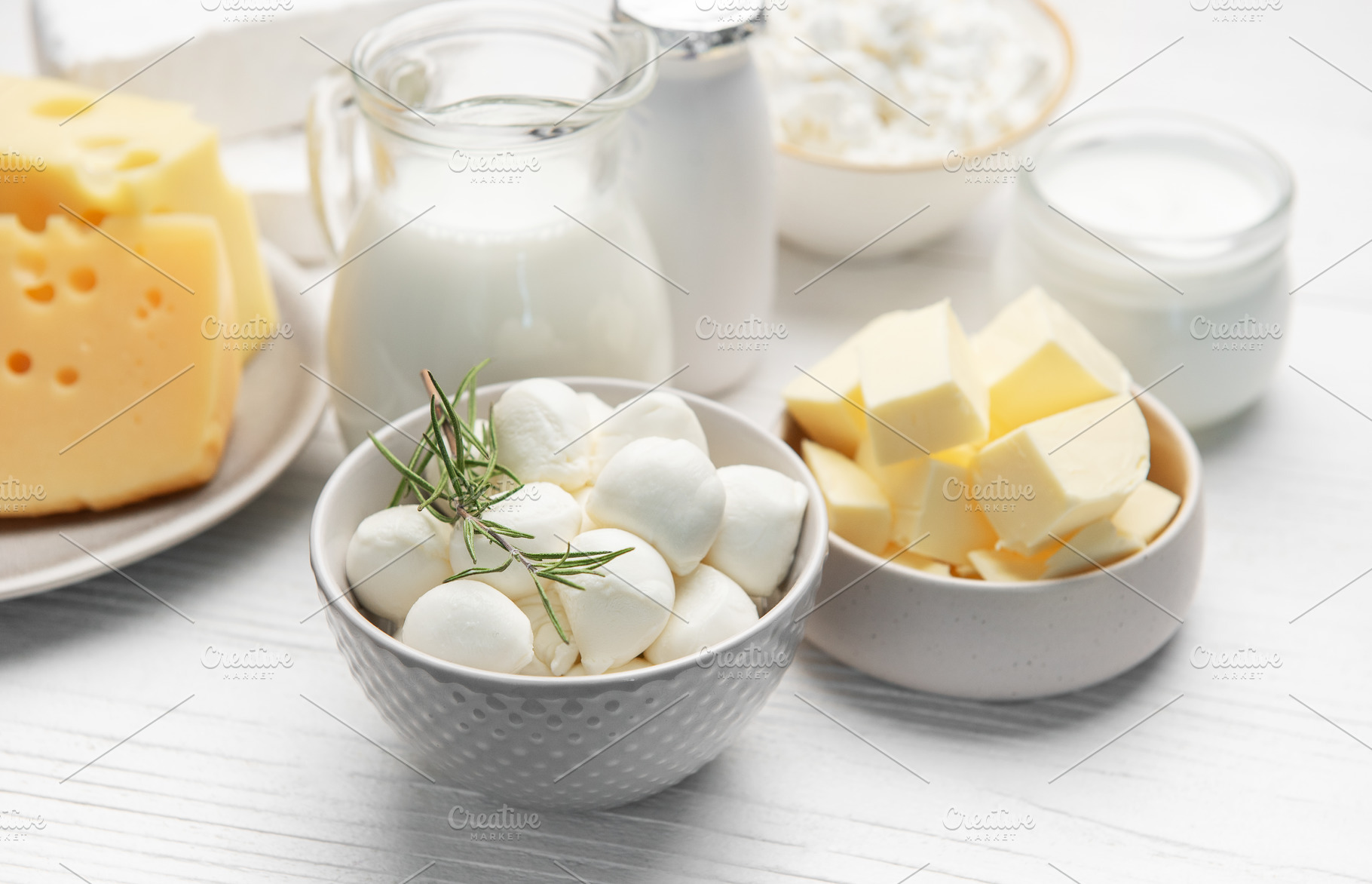 Assorted dairy products including milk, cheese, and butter, a Food & Drink Photo by Olena Rudo