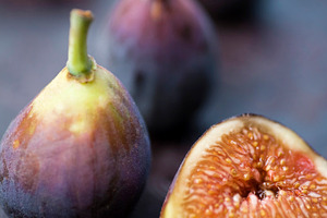 Purple figs featuring purple, fig, and plate