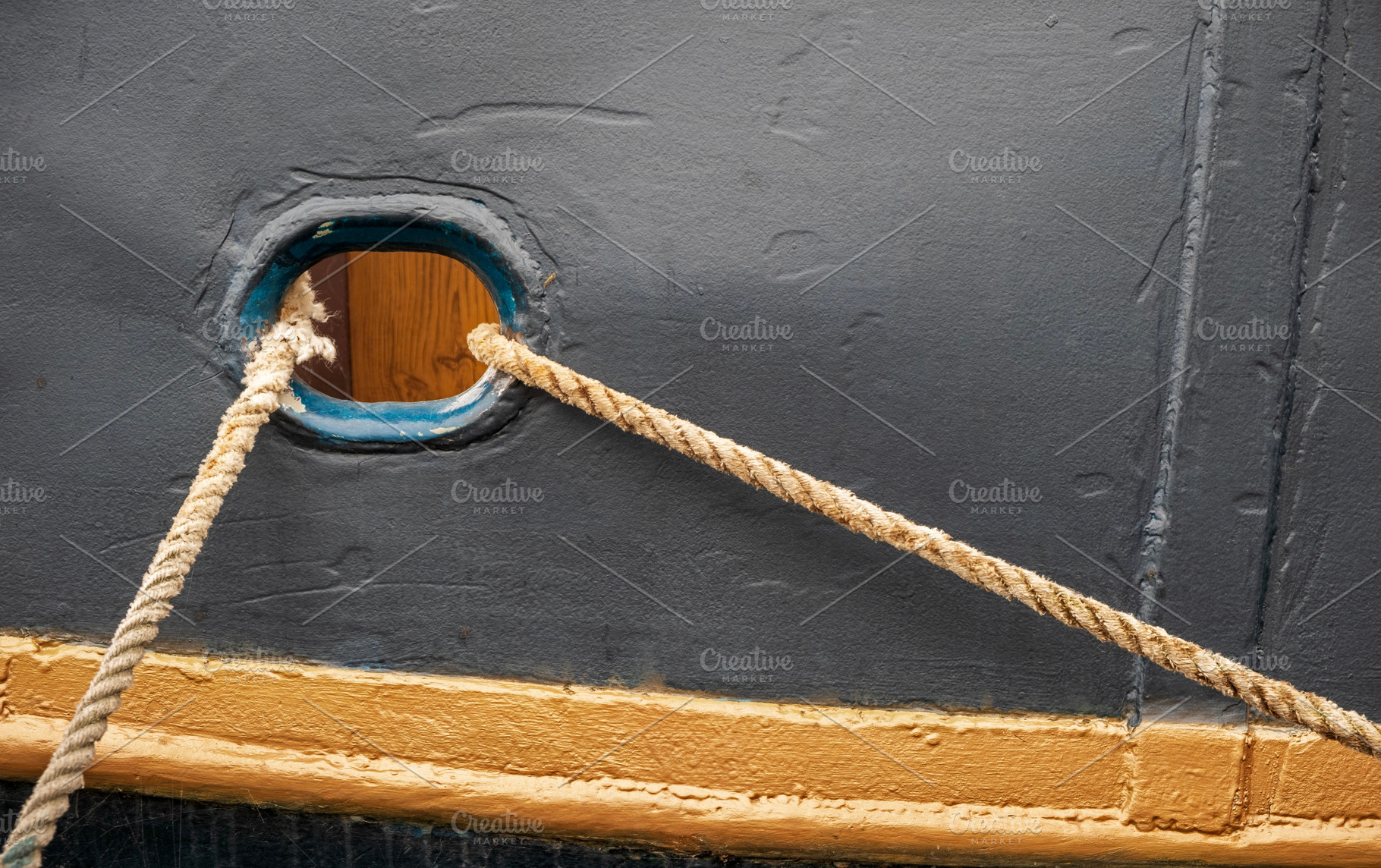 Old boat detail with mooring rope, a Transportation Photo by BOOCYS