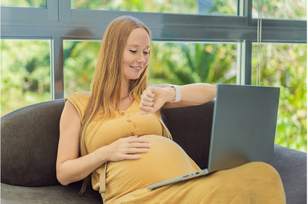 Pregnant woman working on laptop, a Person Photo by Elizaveta Galitskaya