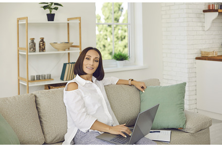 Senior beautiful woman uses laptop, a Person Photo by StudioRomantic