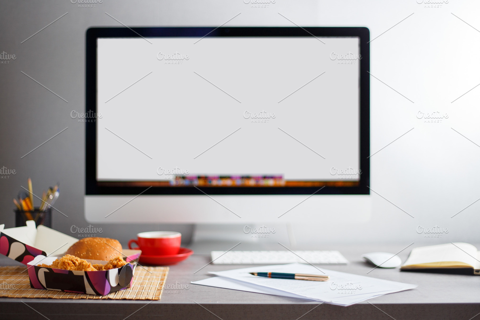 Workplace with empty monitor, lunch, a Technology Photo by serkum