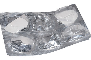 Empty blister pack of round pills on isolated background, a Health & Medical Photo by ndanko