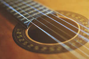 Guitar containing guitar, strings, and music
