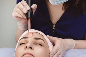 Spa therapy for young woman featuring beauty salon, dermatology, and spa
