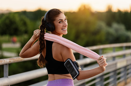 Young woman with headphones and towe, a Sports & Recreation Photo by Perpis
