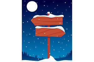Wooden signpost in snow covered