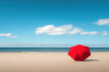 Bright red umbrella stands alone on, a Photo by Iftikhar Alam
