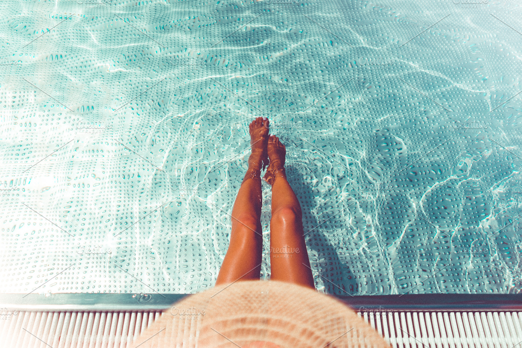 Woman Legs in the Swimming Pool, a Photo by Viktor Hanacek