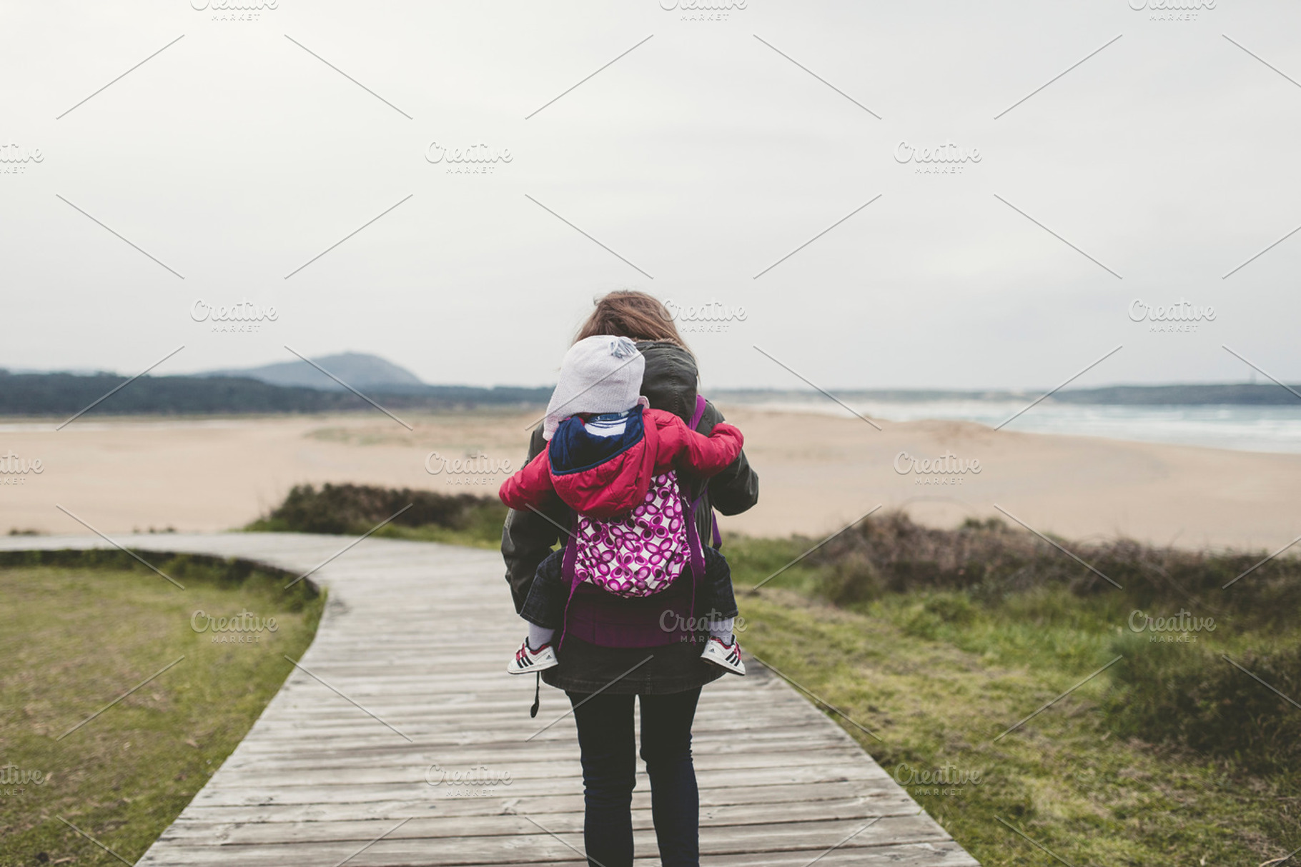 Mother carrying her child stock photo containing baby and family, a Person Photo by Photoweb00
