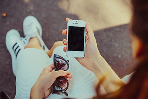 Girl holding iphone mock up stock photo containing mock up and iphone 4