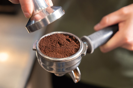 Barista Use Tamper to Press Coffee
