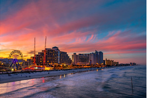 Colorful sunset above Daytona Beach, an Architecture Photo by Nick Fox