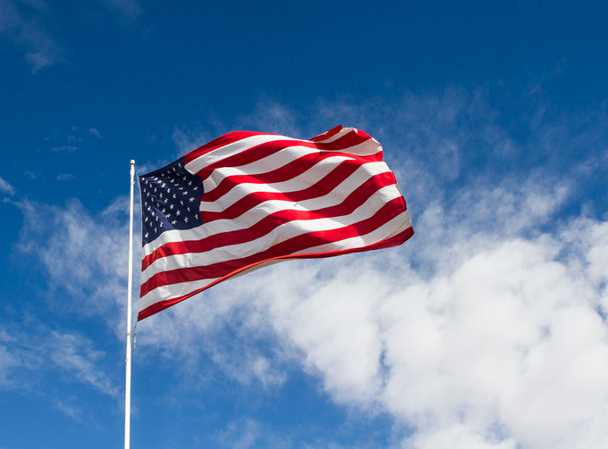 Large american fiag in breeze containing america, american, and copy ...