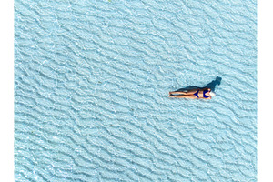Aerial view of woman in bikini and, a Person Photo by den-belitsky