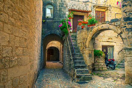 Street view with rustic houses, an Architecture Photo by Alpine Dreams
