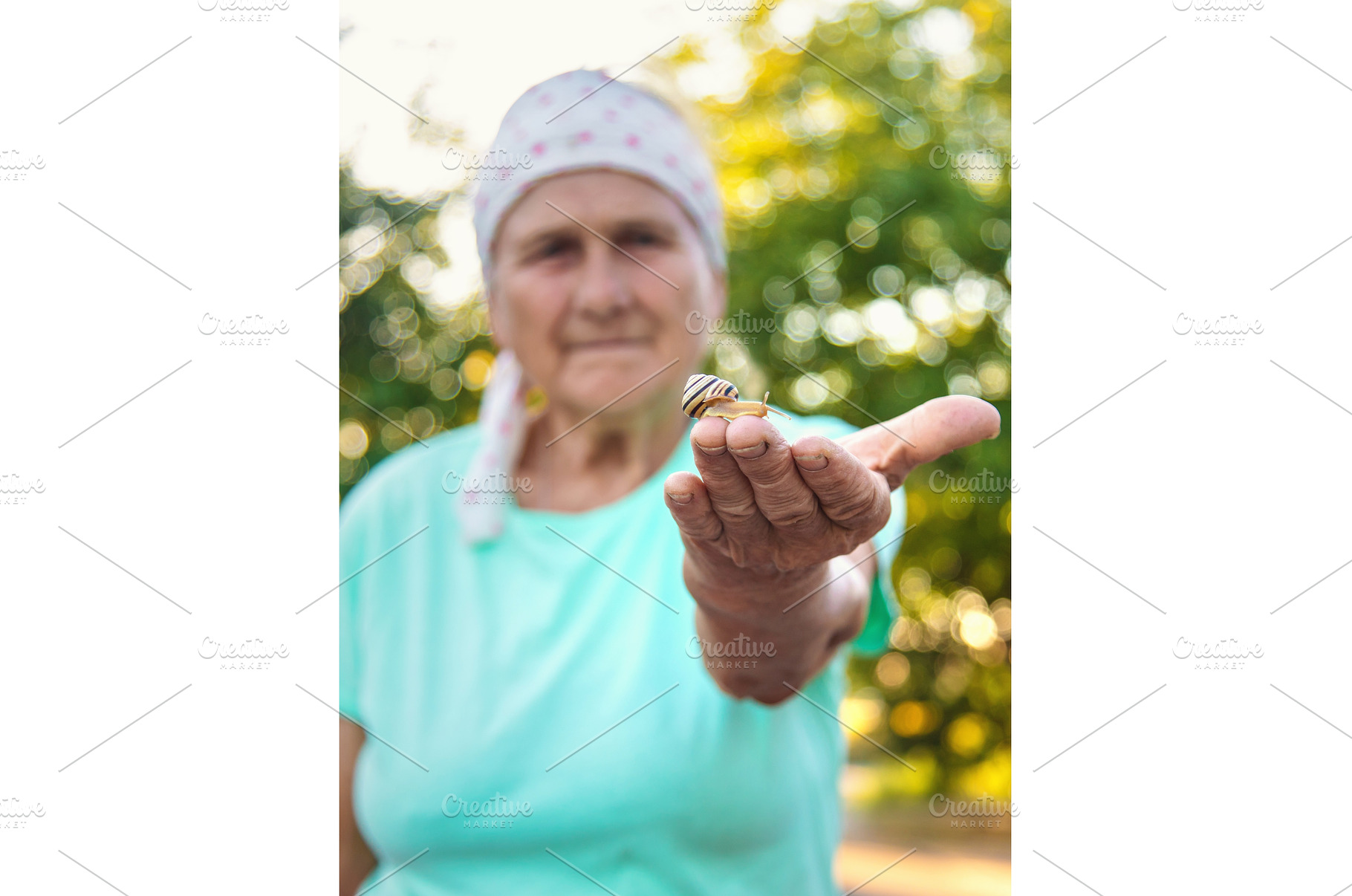 Grandmother is studying a snail in, a Nature Photo by yanadjana