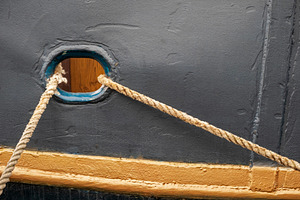 Old boat detail with mooring rope, a Transportation Photo by BOOCYS