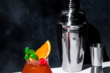 Red fruit cocktail drink with rum, pineapple juice, ssrop, orang, a Food & Drink Photo by 5PH
