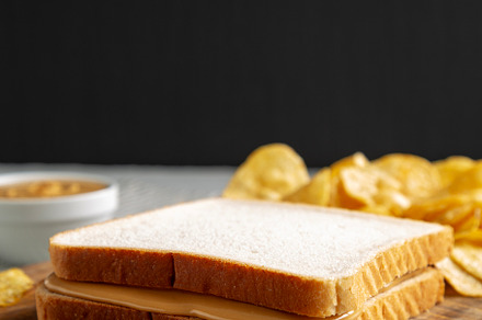 Homemade American Peanut Butter Sandwich on a Wooden Board, side